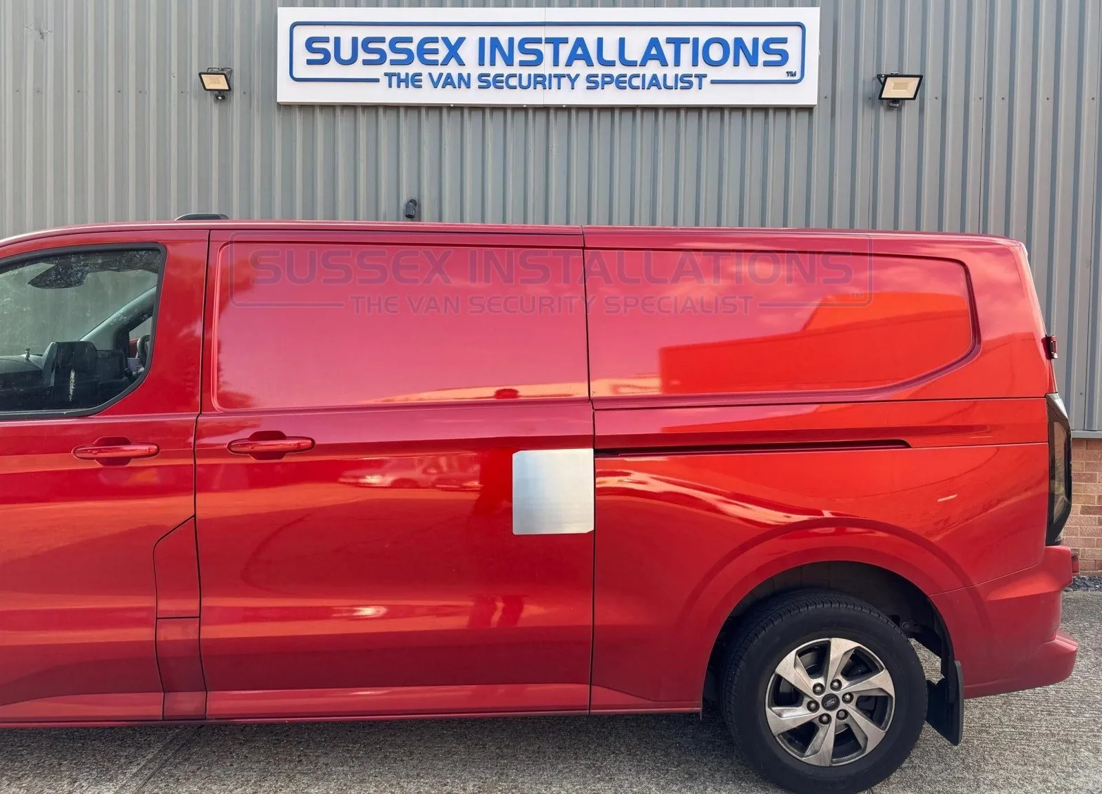 A side load door repair shield in a brushed stainless steel finish